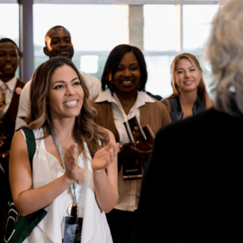 Woman Smiling at Professional Conference